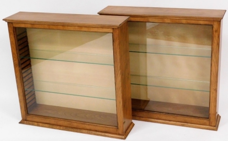 Two light wood display cabinets, each with cornice top and various glass shelves, 75cm high, 78cm wide, 20cm deep. (2)