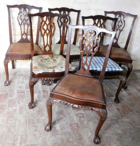 A set of six Chippendale style mahogany dining chairs, each with upholstered seat in varying material.