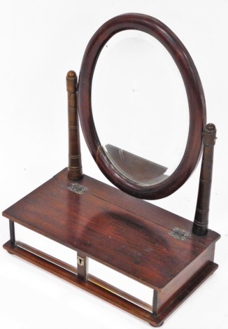 A mahogany dressing table mirror, with oval mirror plate on two stand supports, with two mirrored fronts and lift up lid, 64cm high, 42cm wide, 22cm deep.