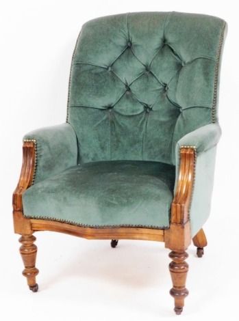 A Victorian button back armchair, in green draylon with walnut framed and reeded supports, 105cm high, 68cm wide, 42cm deep.