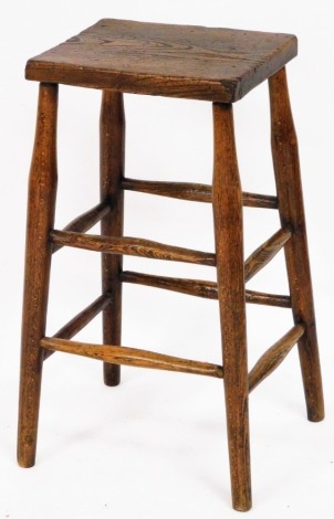 A rustic elm stool, with two panelled leg supports on tapered legs, 61cm high.