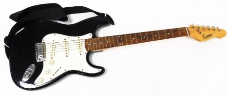 An Encore electric guitar, in black.