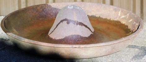 A Mexican type hat iron animal feeder, 90cm diameter.