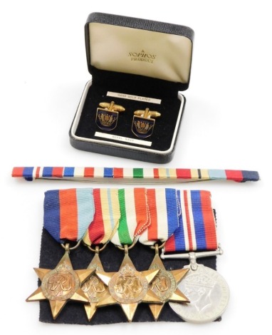 A medal set, to include a 39-45 star, the Africa Star, the Italy Star, the France and Germany Star and the 39-45 war medal, with no awards, and ribbon band, together with a set of Royal Navy cufflinks.