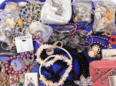 A group of various costume jewellery, diamante set necklaces, a modern art brooch, possibly silver, various dress rings, etc. (1 box)