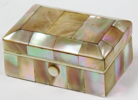 A mother of pearl inlaid trinket box, rectangular with three sectional top and a cream lined interior, 7cm wide.