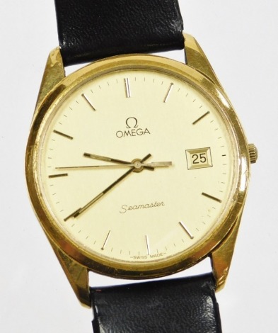 A gentleman's Omega automatic wristwatch, with date aperture, gold plated with stainless steel back on a black leather strap, the dial 3cm diameter.