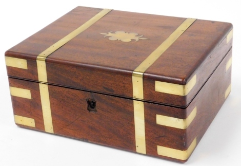 A 19thC mahogany brass bound writing slope, with central shield and brass striped banding, 14cm high, 30cm wide, 22cm deep.