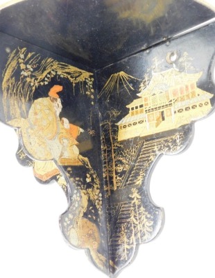 A Victorian papier mache wall shelf, on black ebonised base, with gilt decoration of Oriental figures and buildings, 18cm high, 25cm wide. - 2