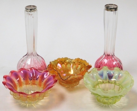 A group of Victorian vaseline and cranberry glass, to include a pair of George V cranberry glass bud vases, each with silver rim, 21cm high, a glass bowl and two Victorian vaseline glass bowls. (5)