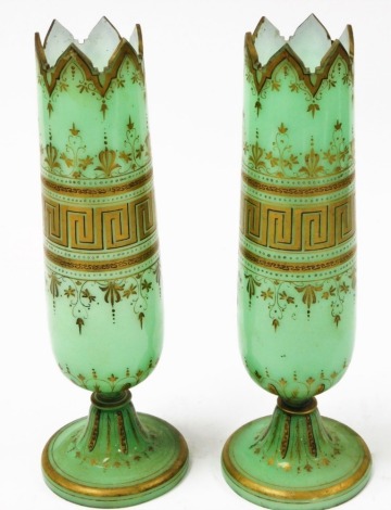 A pair of Victorian overlay glass vases, in green with gilt top, 34cm high.