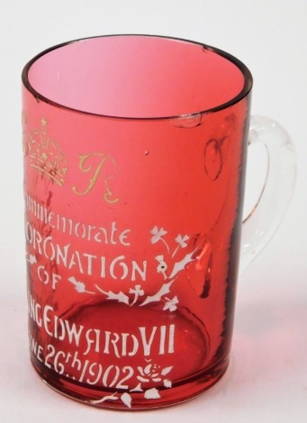 A Edward VII cranberry glass commemorative tankard, with white applied detailing to commemorate the coronation of HM King Edward VII June 26th 1902, 8cm high.