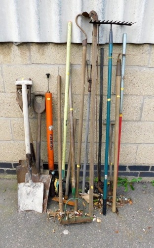 A group of various garden tools, to include rakes, spades, agricultural tools, etc. (a quantity)