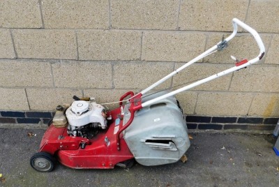 An Asper petrol lawnmower.