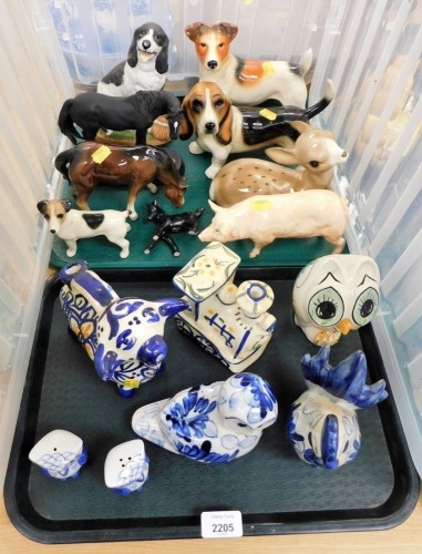 A group of various ornaments, dog ornaments, blue and white wares, pig ornament, seated Bambi, horse, etc. (2 trays)