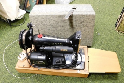 A cased Singer sewing machine.