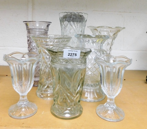 A group of glass vases.