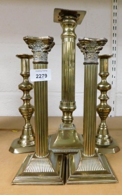 Five various brass candlesticks, an alter stick. etc. (5)