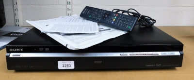 A Sony DVD recorder RDR-HXD870, with power lead and remote control.