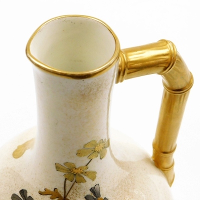 A Royal Worcester porcelain jug, on cream ground, heavily gilt decorated with storks and floral sprays and a bamboo style gilt handle, green stamp to underside, 26cm high. - 5