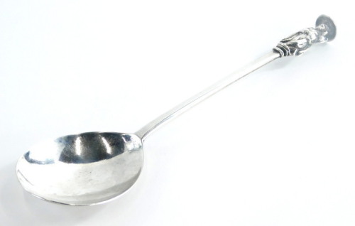 An early 18thC silver apostle spoon, modelled with a book or scroll, marks indistinct, maker RP, 1¼oz.