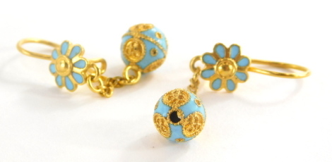 A pair of Eastern style enamel drop earrings, each with pale blue enamel flower and ball design, in yellow metal, marked 750, 3.5cm high, 4.2g all in.