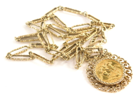 An Elizabeth II full gold sovereign pendant and chain, dated 1966 in scroll detailed 9ct gold pendant frame, on hammered elongated link chain, yellow metal, unmarked, 74cm long, 38g all in.