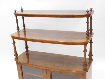 A Victorian figured walnut and marquetry whatnot cabinet, with two graduated bowfronted tiers, each on turned supports on finials, the base with two glazed doors, on bun feet, 125cm high, 106cm wide. - 2