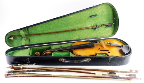 A late 19th/early 20thC violin, with a two piece back, lacking label, (neck AF), length of back 36cm, and a quantity of violin bows, one stamped J. La Salle.