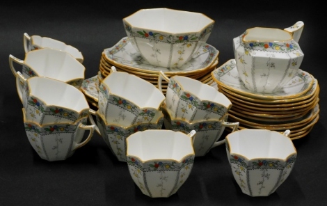 A Shelley part tea service, decorated with leaves, fruit, etc., pattern number 11563, registration number 723404, to include twelve cups, sugar bowl, milk jug, twelve saucers, etc.