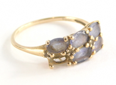 A 9ct gold amethyst dress ring, set with six oval amethysts (1 missing), in claw setting with tiny cz set shoulders, the band fully hallmarked 375 and also stamped 10k, ring size U, 2.5g all in.