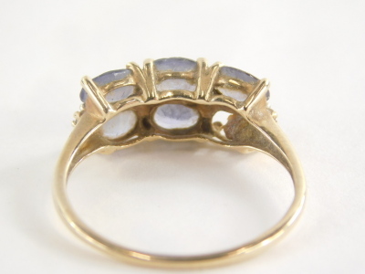 A 9ct gold amethyst dress ring, set with six oval amethysts (1 missing), in claw setting with tiny cz set shoulders, the band fully hallmarked 375 and also stamped 10k, ring size U, 2.5g all in. - 2