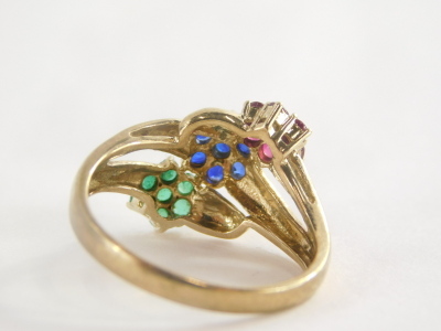 A 9ct gold dress ring, set with three layered design of flowers, with emeralds, rubies and sapphires, ring size S, 3.8g all in. - 2