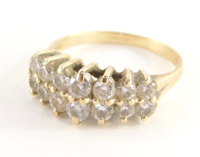 A diamond dress ring, with two rows of round brilliant cut diamonds, each in claw setting, approx 0.05cts each, yellow metal, stamped 585 14kt, ring size P½, 4.3g all in.