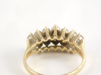 A diamond dress ring, with two rows of round brilliant cut diamonds, each in claw setting, approx 0.05cts each, yellow metal, stamped 585 14kt, ring size P½, 4.3g all in. - 2