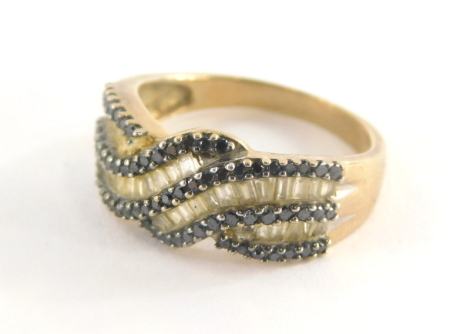 A 9ct gold multi layered dress ring, with sapphire and diamond set ring head marked TGCC, ring size P½, 4.1g all in.