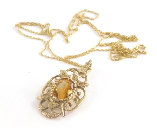 A 9ct gold pendant and chain, the floral pendant set with citrine, 3cm high, on a fine link chain, 46cm long, 2.3g all in.