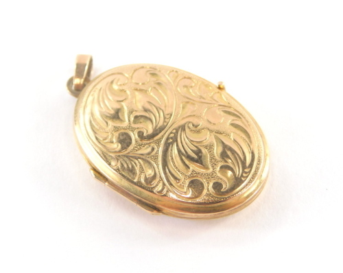 A 9ct gold locket pendant, with leaf scroll detailing and single pendant loop, 2.5cm high, 3.4g.