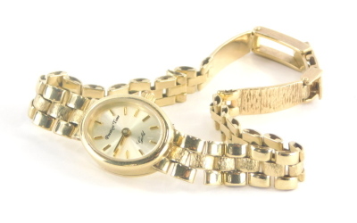 A Prestige Time 9ct gold ladies wristwatch, with small circular watch head, marked 9k 375, on a three bar bark effect design bracelet, marked 9kt, 18.3g all in.