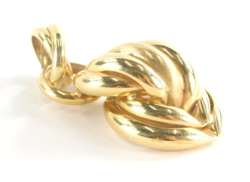 An 18ct gold pendant, of cross and twist loop design, marked Italy, 4.5cm high, 5.4g all in.