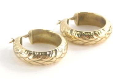 A pair of 9ct gold hoop earrings, each with leaf design, 2.5cm high, 4.8g.