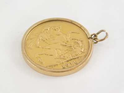 A George V full gold sovereign pendant, dated 1911, in a 9ct gold pendant mount, 8.8g all in. - 2