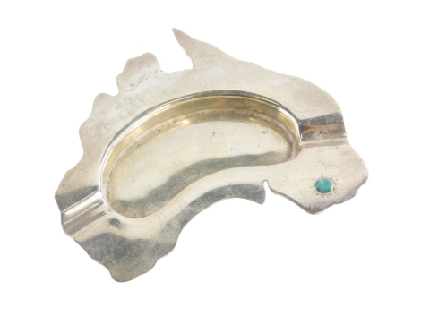 A novelty white metal ashtray, inset with an opal, possibly moulded in the shape of Australia, stamped to underside Prouds, 1¼oz.