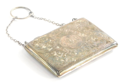 A late 19th/early 20thC silver ladies card case, engraved with scrolls, etc., the cartouche BMJ?, with a brown leather interior, on a silver plated chain, hallmarks indistinct, 9cm long.