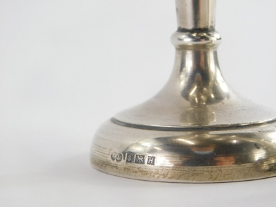 An Elizabeth II silver trumpet shaped vase, base loaded, Birmingham 1957, and another with a fluted rim. (AF) - 2