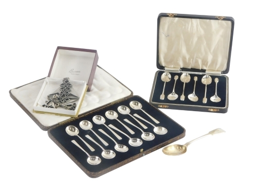 A set of twelve George V silver teaspoons, of plain form, cased, Sheffield 1926, 2oz, a set of six George VI silver teaspoons, cased, Birmingham 1937, 1¼oz, a further teaspoon, and a Brutus style pewter pendant and matching earrings. (a quantity)