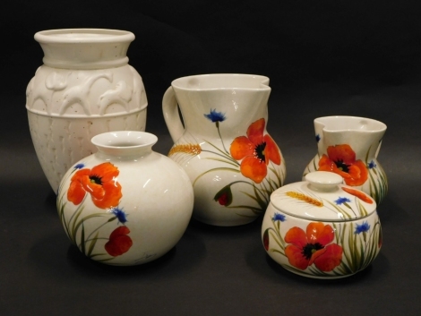 A collection of four pieces of Italian Nuovo Ceramica, retailed by Sovereign Ceramics Ltd Staffordshire, each piece with indistinct monogram and decorated with poppies, etc., one AF, and a moulded pottery vase decorated with animals.