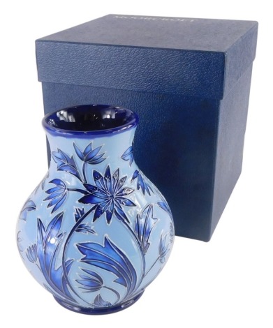 A Moorcroft blue Florian ware vase, decorated with flowers, leaves, etc., hand written mark to underside for Hancock, limited edition number 21/50, 15cm high.