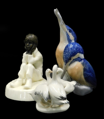 A Royal Copenhagen porcelain figure group of two kingfishers, a Minton Spellbound figure with bronzed head, and a porcelain group of three geese. (3)