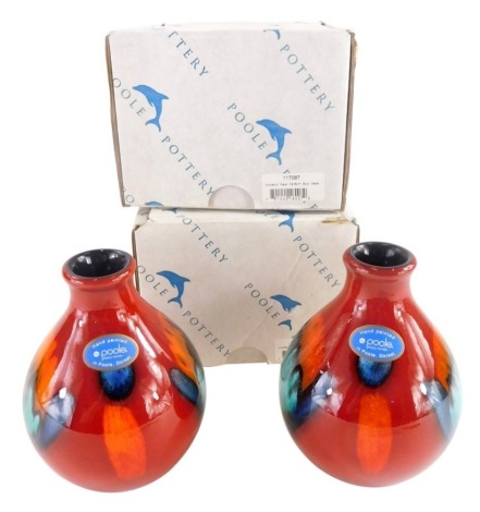 A pair of late Poole Delphis range bud vases, 13cm high, boxed.